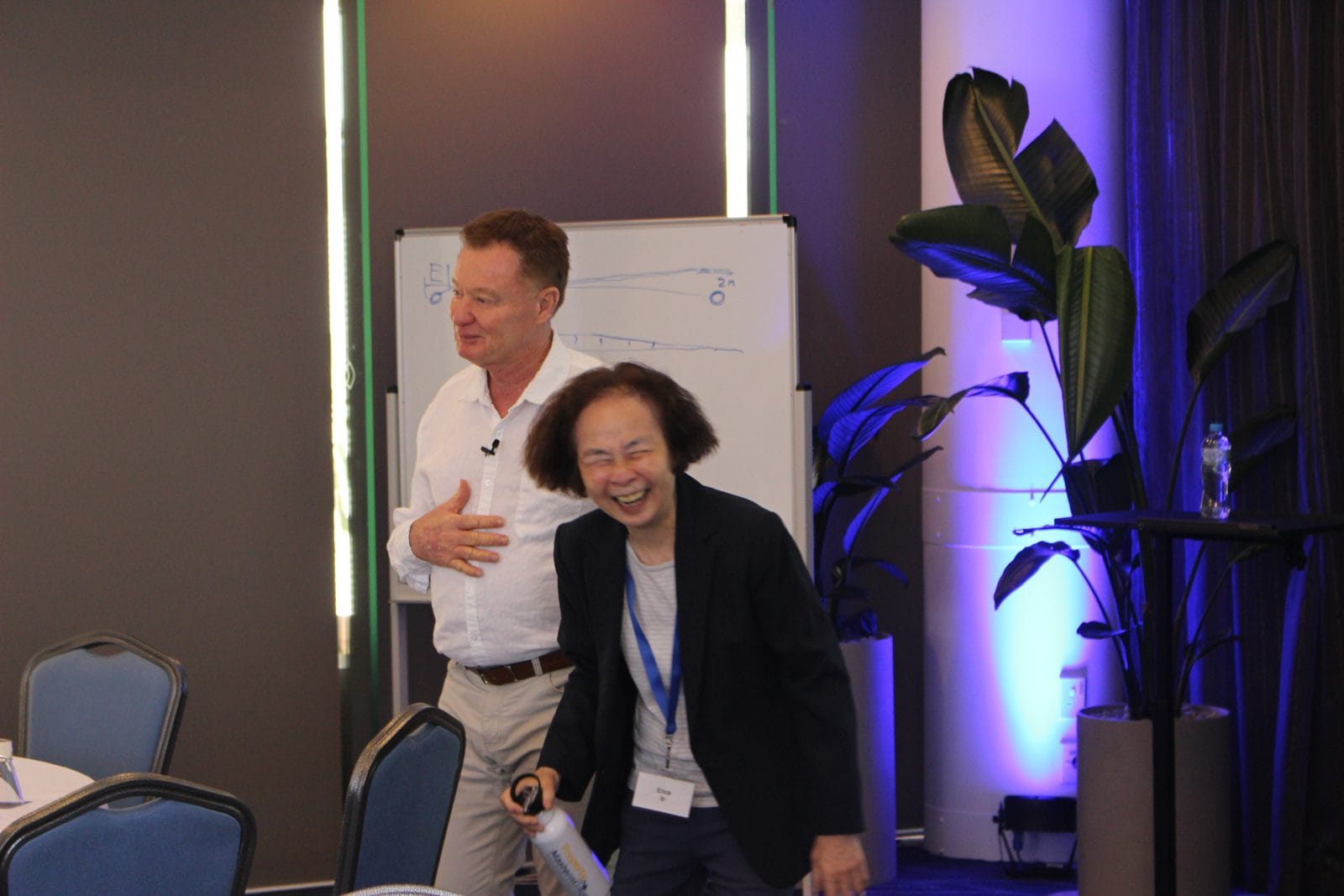 Bob Andersen sharing a laugh with an attendee at a previous workshop